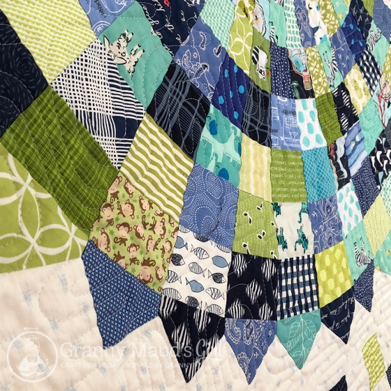 Hand-made baby quilt in blues and greens